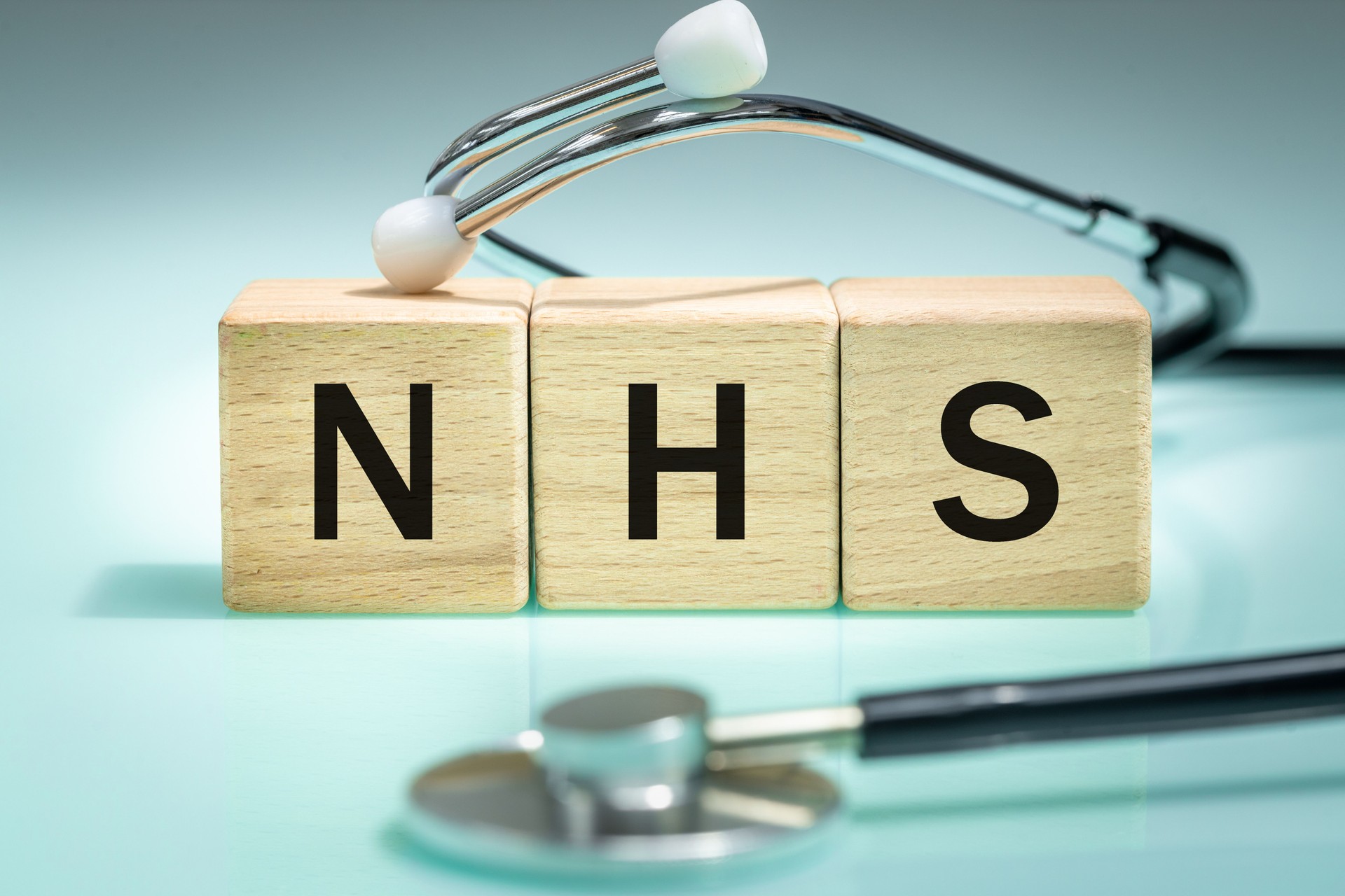NHS, Lettering on Wooden Blocks, National Health Service, collective name for three of the four publicly funded health care systems in the UK. Help in health care